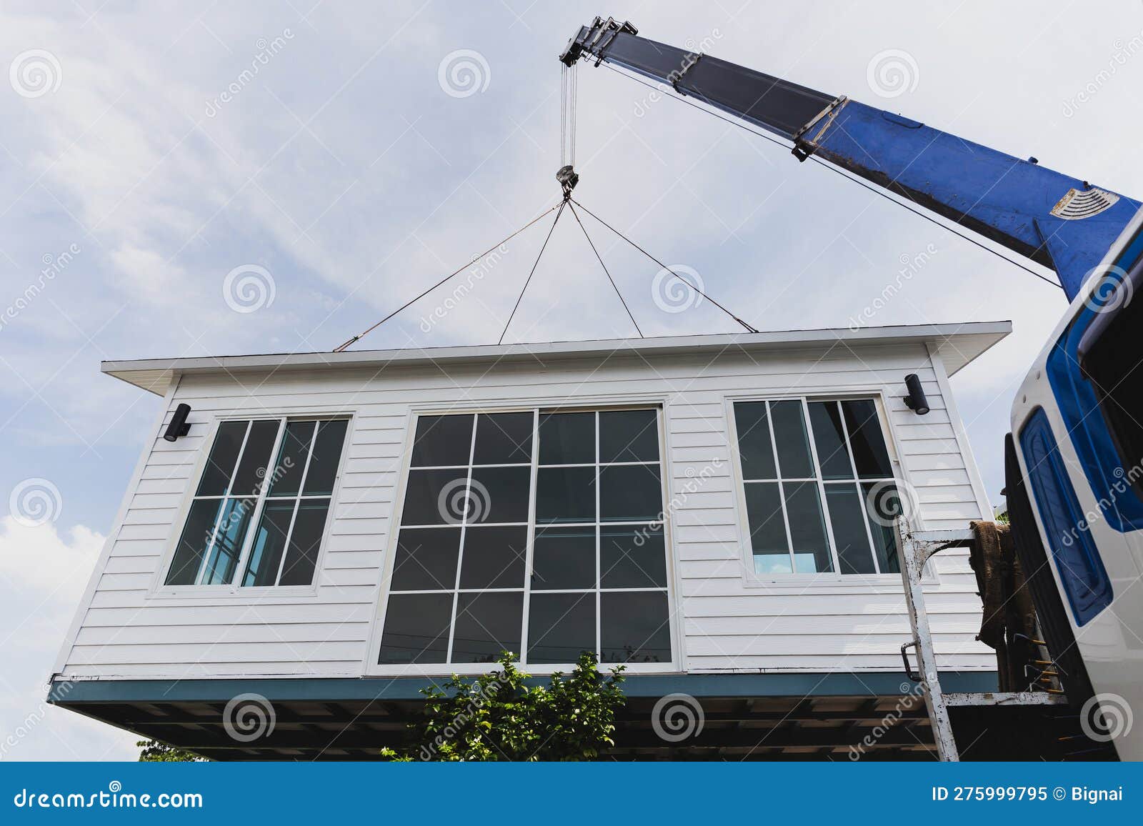 Crane Lifting a Knock Down Private House. Stock Image Image of