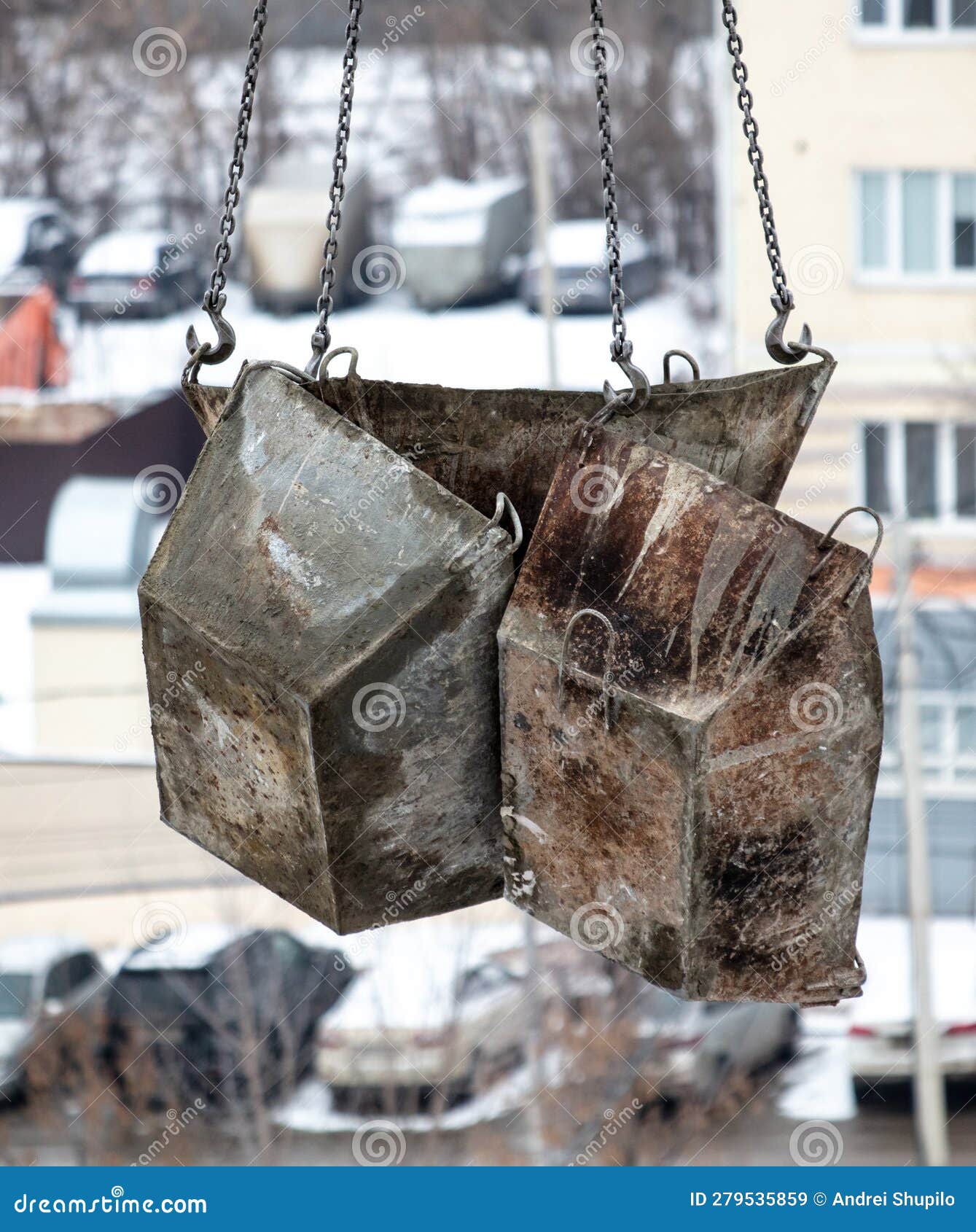 Crane Lowers Containers for Concrete at a Construction Site Stock Image