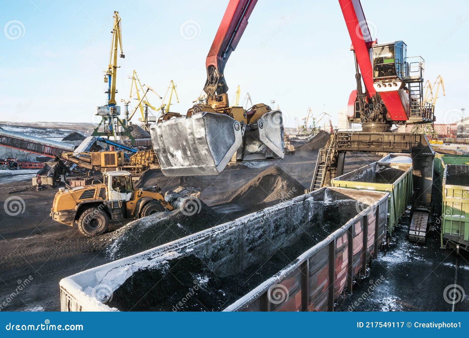 crane manipulator unloads coal at the seaport.