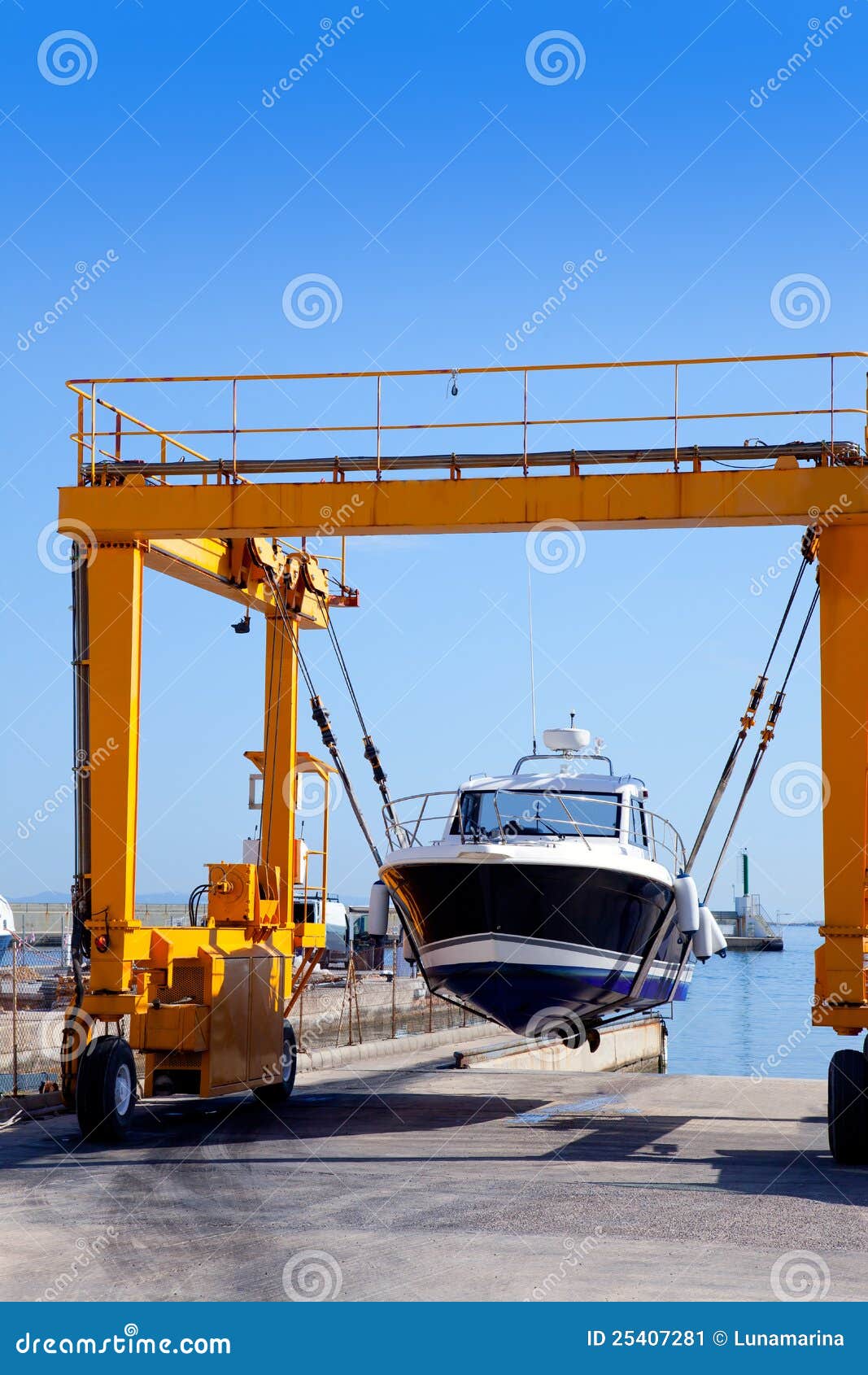 Crane Travelift Lifting a Boat on Blue Sky Day Stock Image Image of