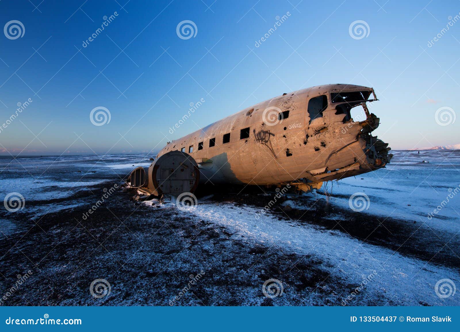 crashed airplane on the black sand beach, iceland