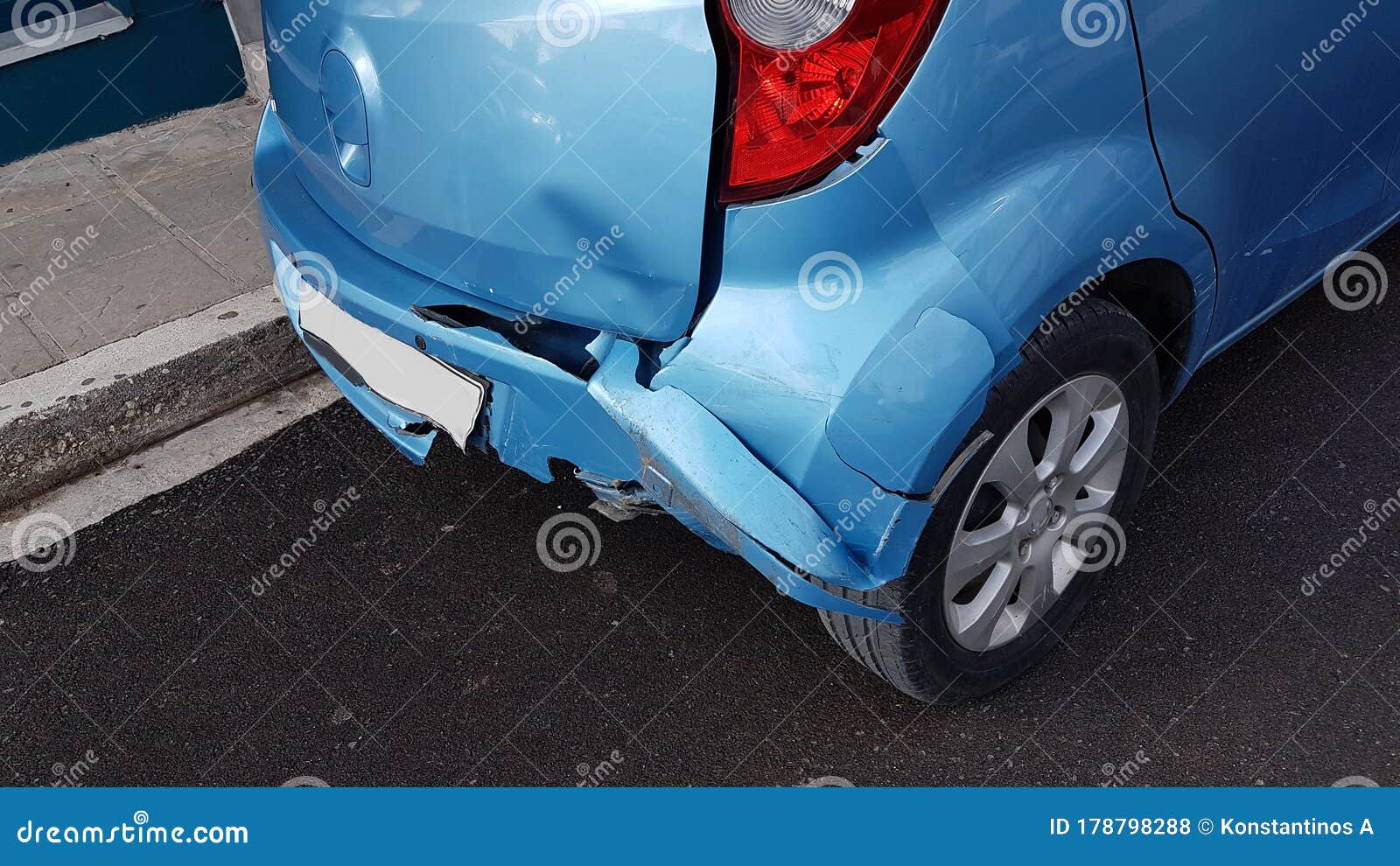 Damaged Blue Car In Crash Accident With Scratched Paint And Stolen