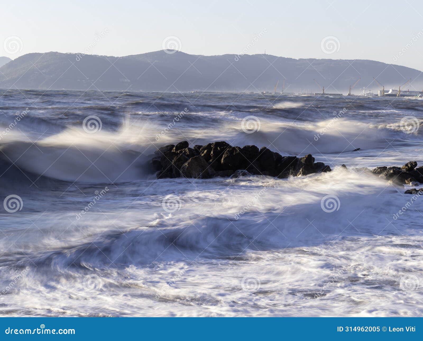 crashing waves on the beach in massa