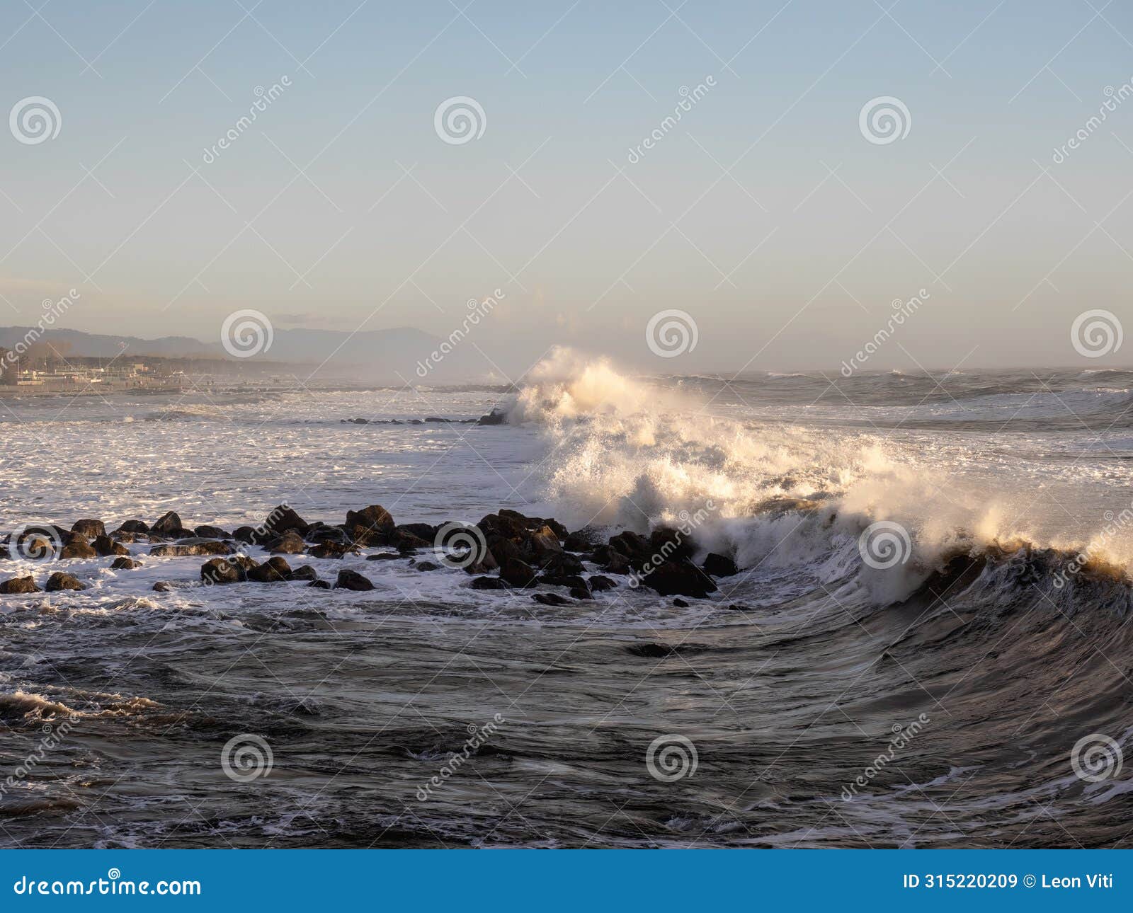 crashing waves on the beach in massa