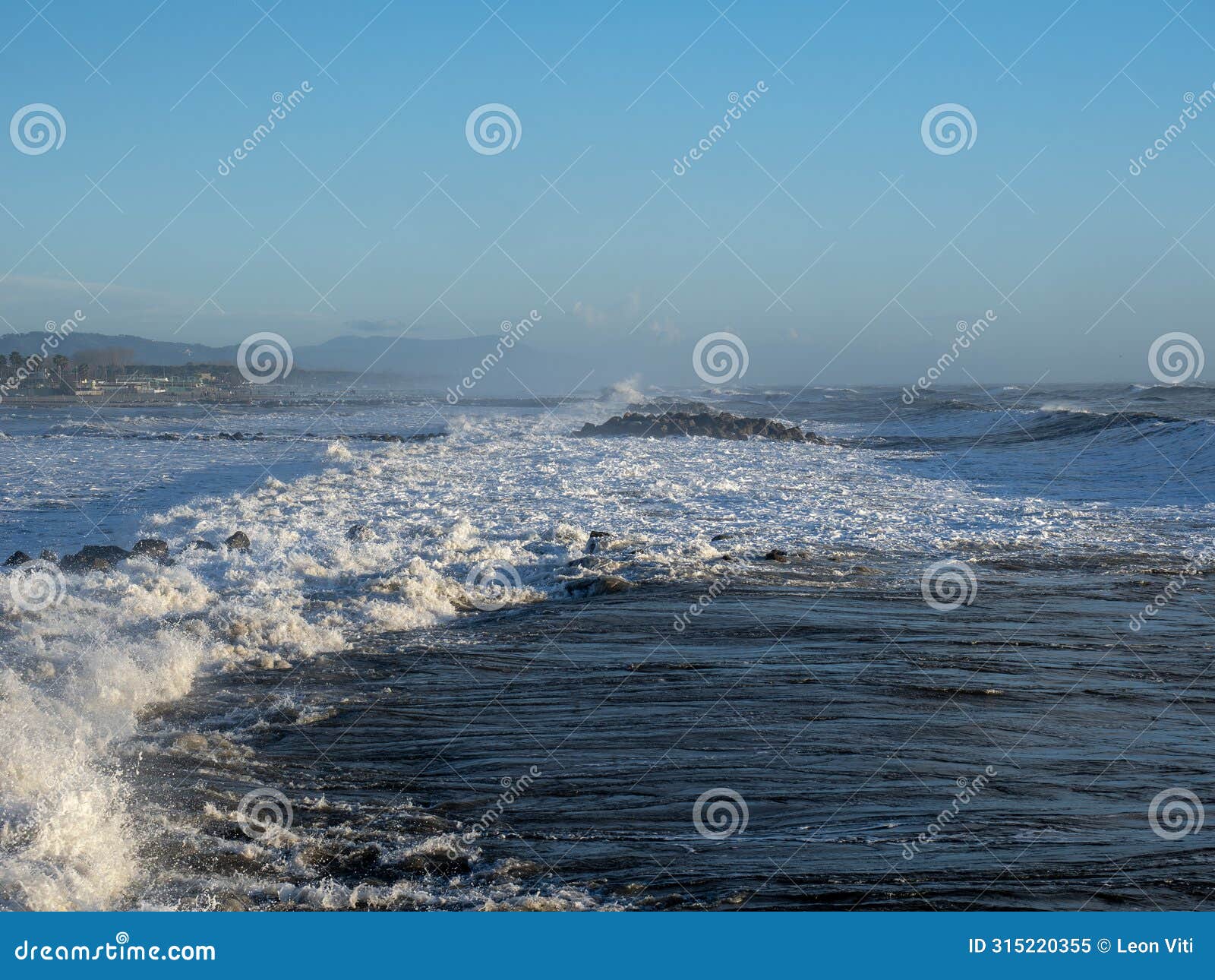 crashing waves on the beach in massa