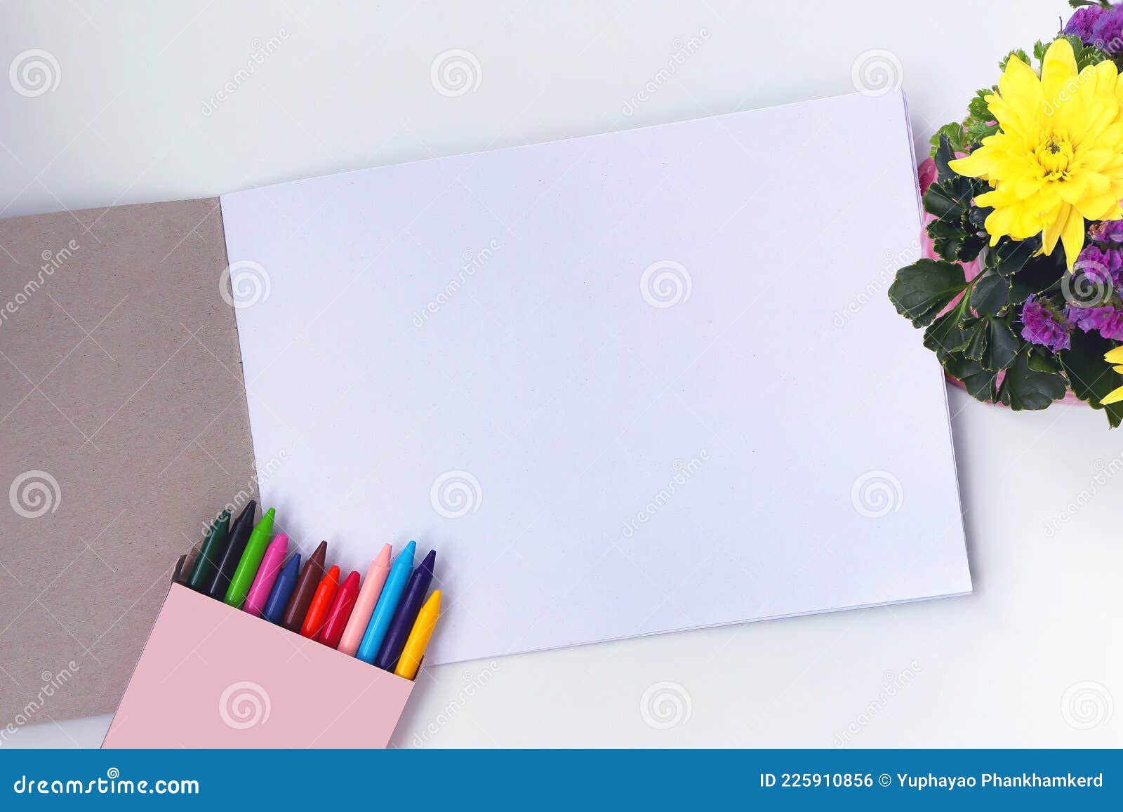 Crayons and Drawing Book on White Background. Stock Photo Image of