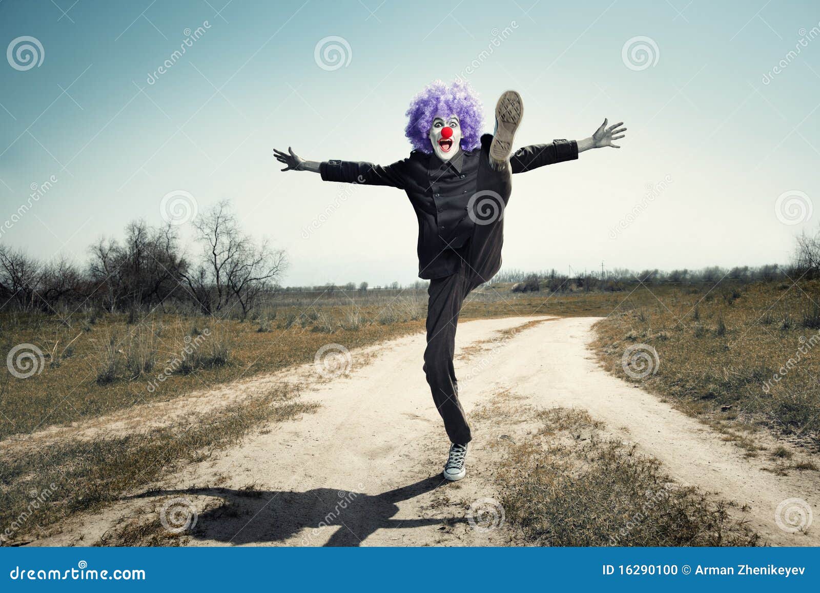 Crazy clown on the road stock photo. Image of buffoon 16290100