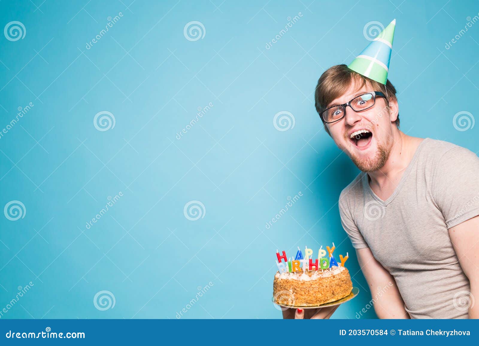 Crazy Funny Positive Guy Hipster with a Happy Birthday Cake Standing on a  Blue Background. Concept of Jokes and Holiday Stock Photo - Image of  greeting, color: 203570584