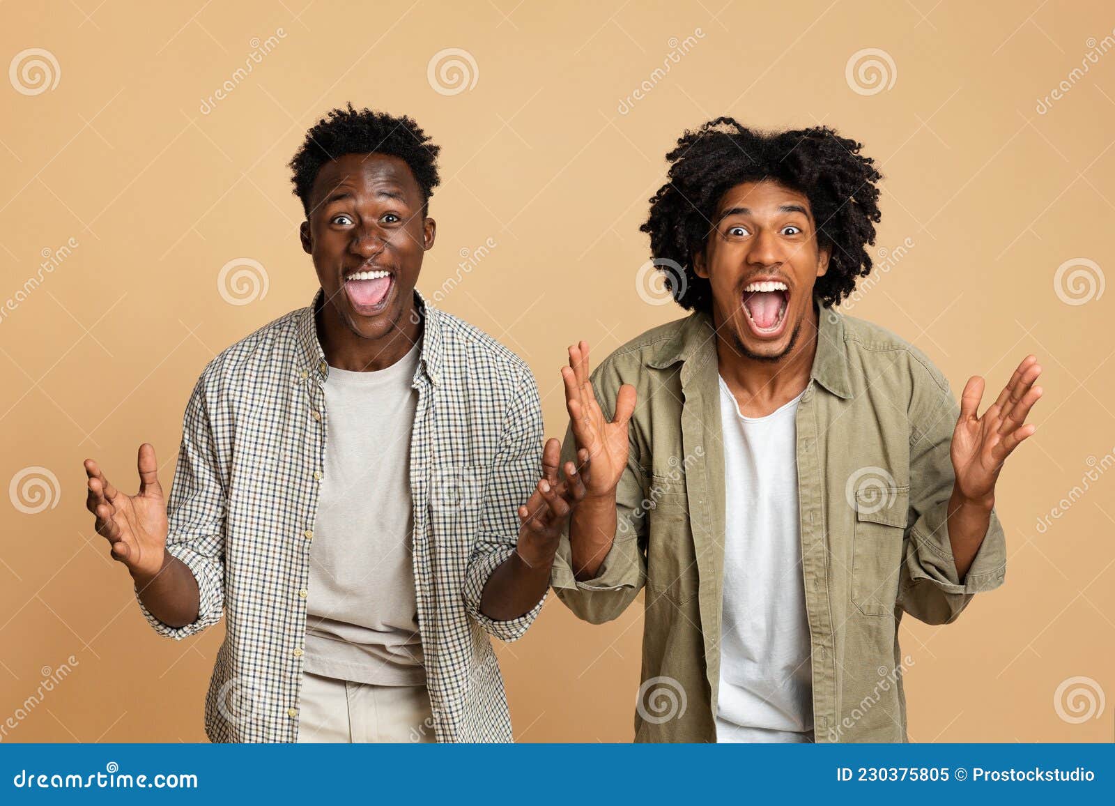 Two Excited Happy Black Guys Raising Hands and Opening Mouth in ...