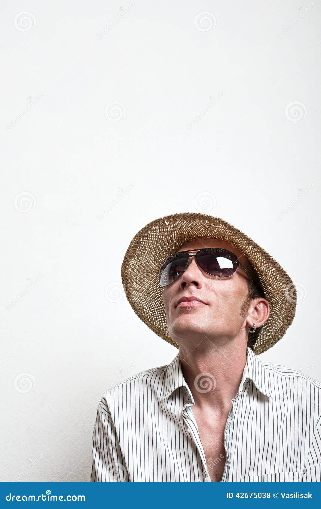 crazy vacationer in straw hat and sunglasses dreaming