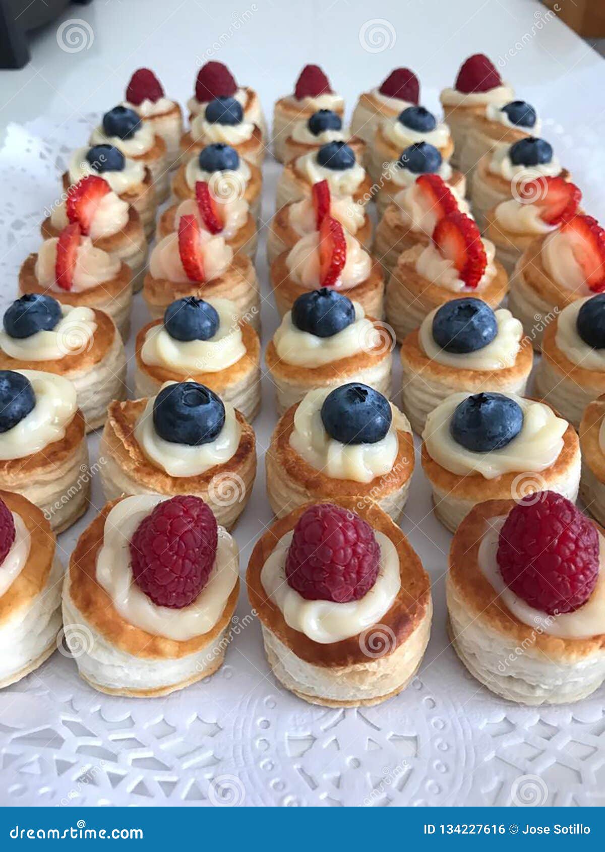 cream cakes with red berries