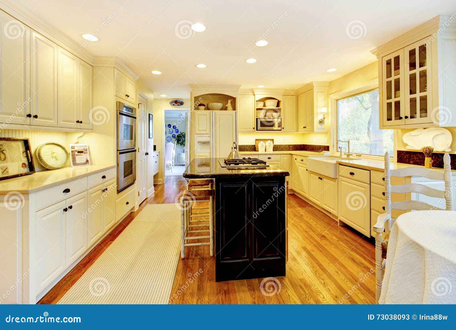 Cream Color Kitchen with Large White Sink and Classic Design. Stock