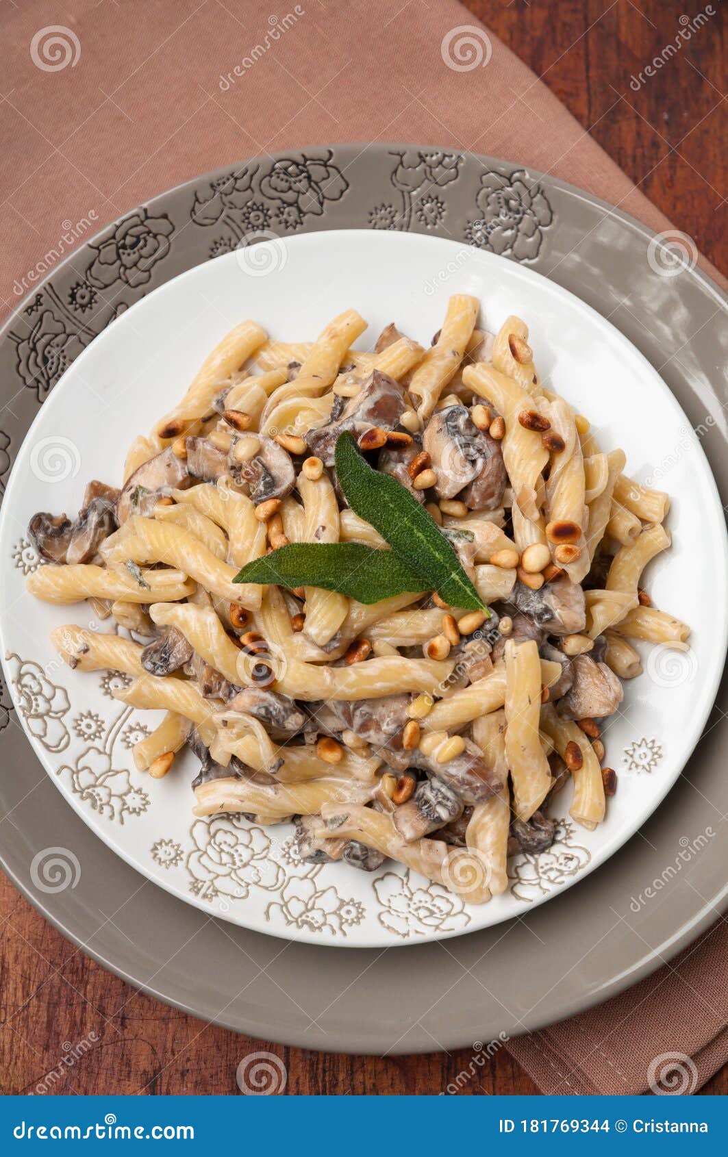 Creamy Mushroom Pasta with Roasted Pine Nuts and Sage Stock Photo