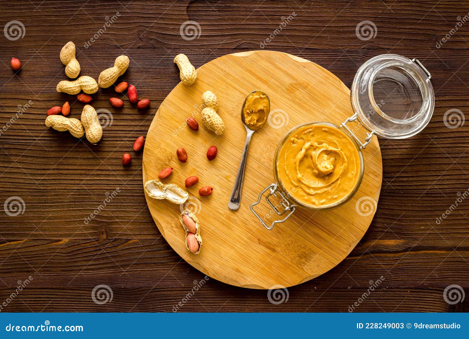 Creamy Peanut Butter in Glass Jar with Nuts, Top View Stock Image