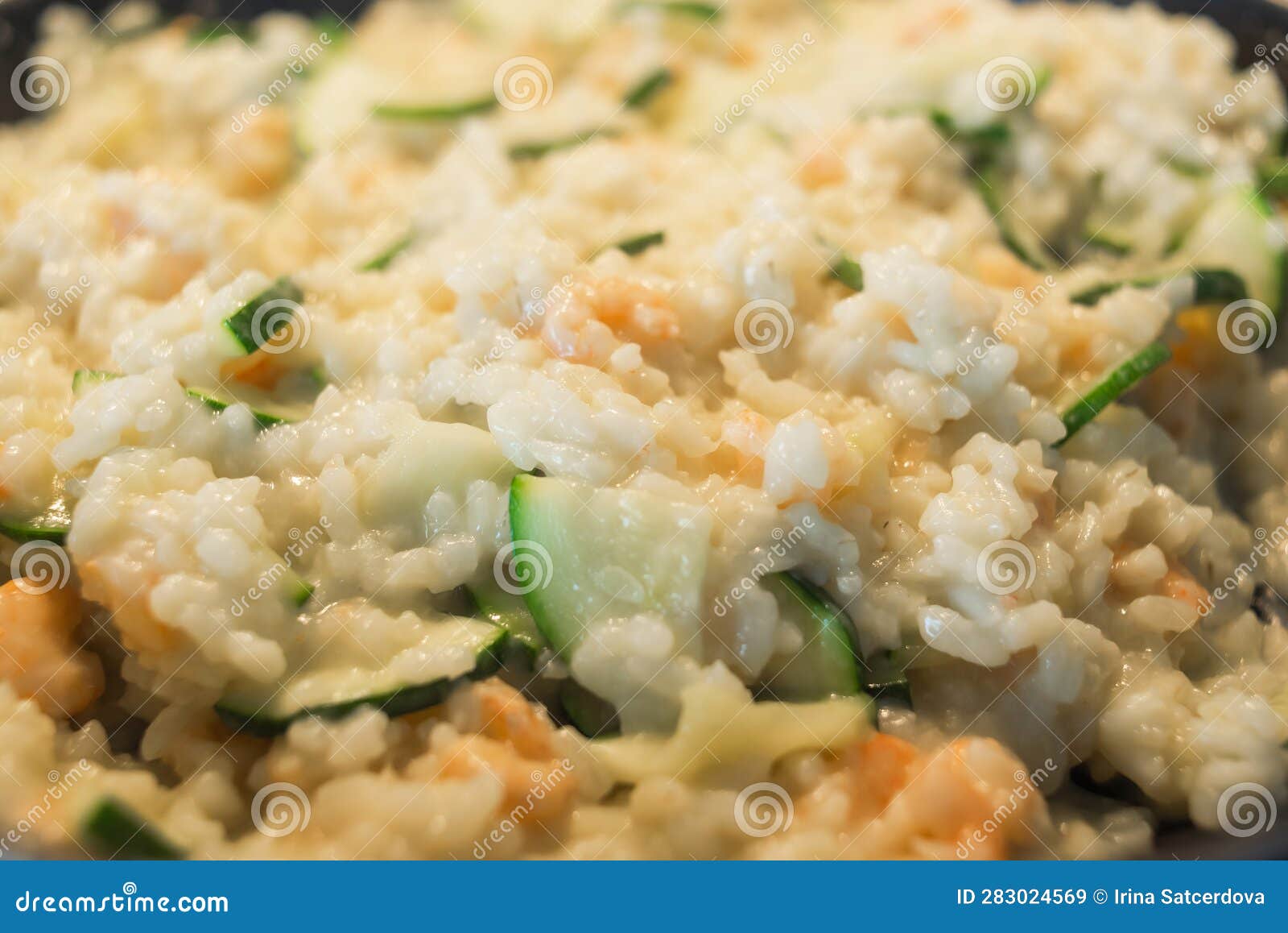 Creamy Risotto with Shrimp and Zucchini in a Frying Pan. Stock Image