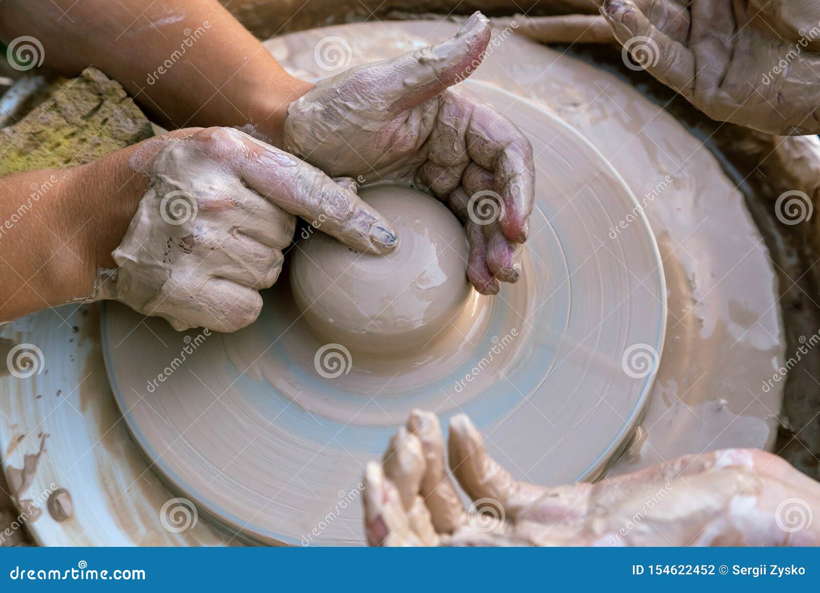 Creating a Sculpture of Clay Closeup. Hands Making Products from Clay