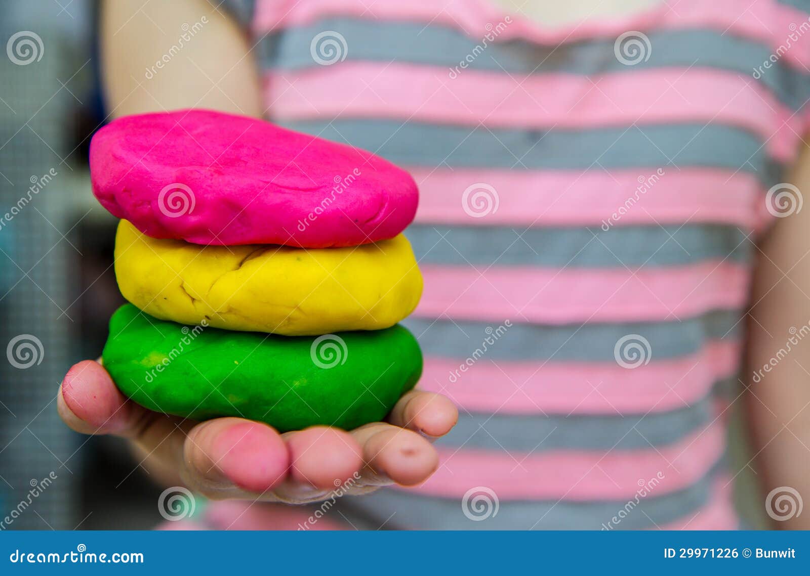 colorful play dough on hand