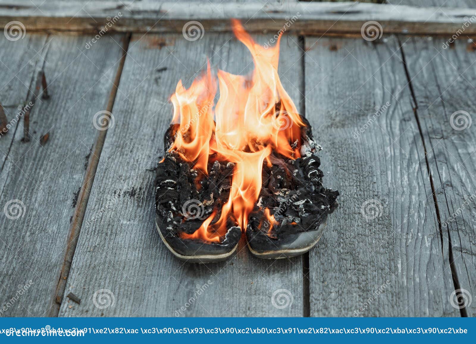 Creative Background, Burning Shoes on a Wooden Background. the Concept ...