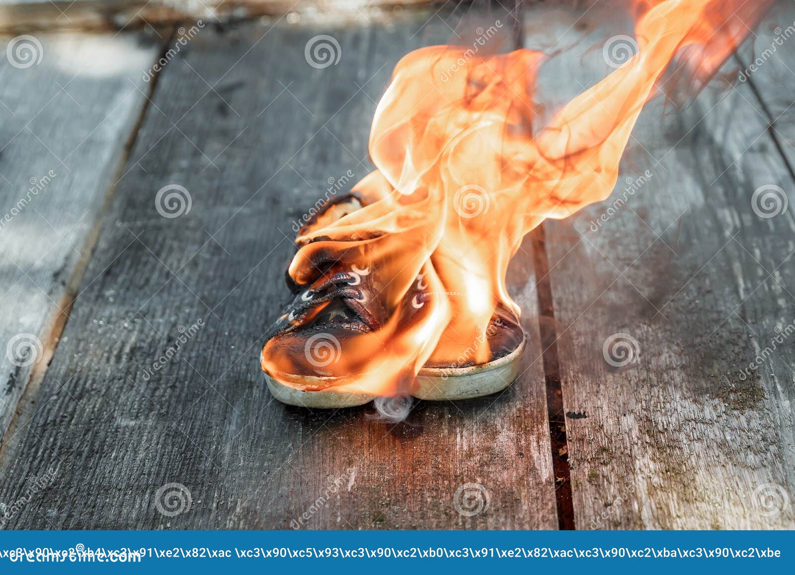 Creative Background, Burning Shoes on a Wooden Background. the Concept ...