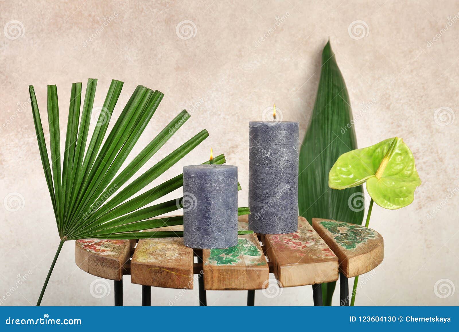 Creative Composition with Candles and Tropical Plants on Stock Photo