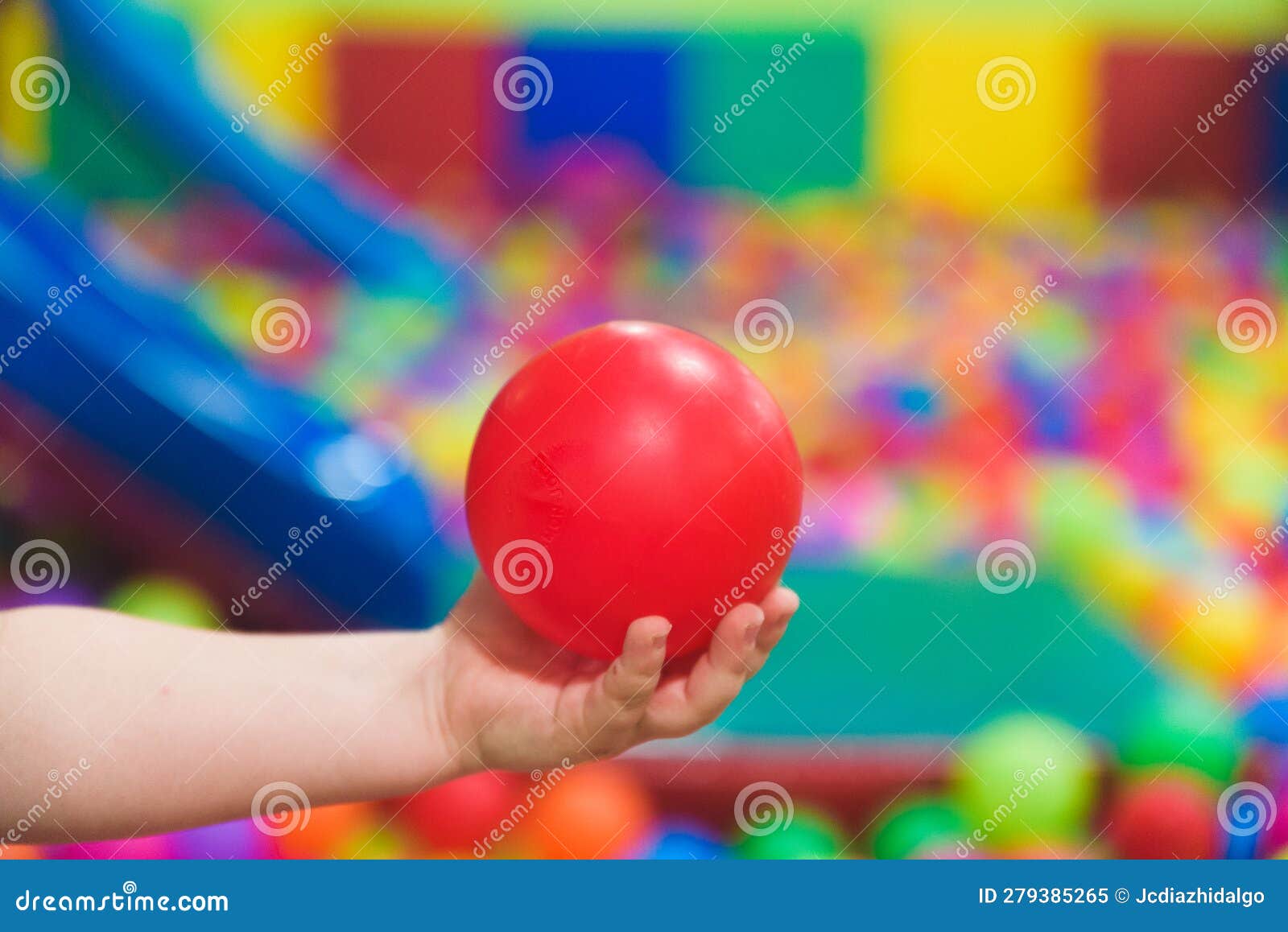Creative Development of Children. the Child Plays with Colored Balls in