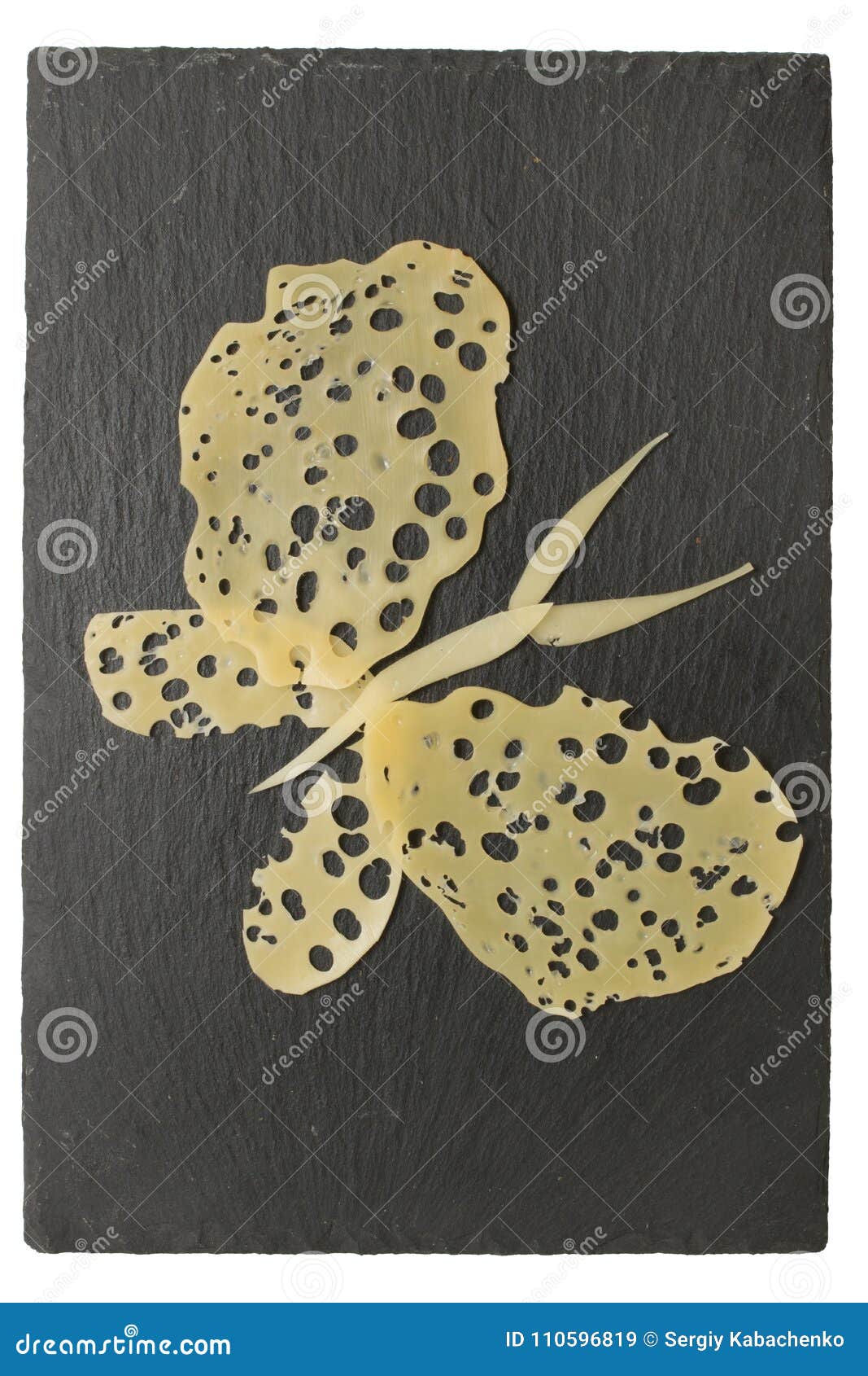 butterfly made with cheese slices on black tray