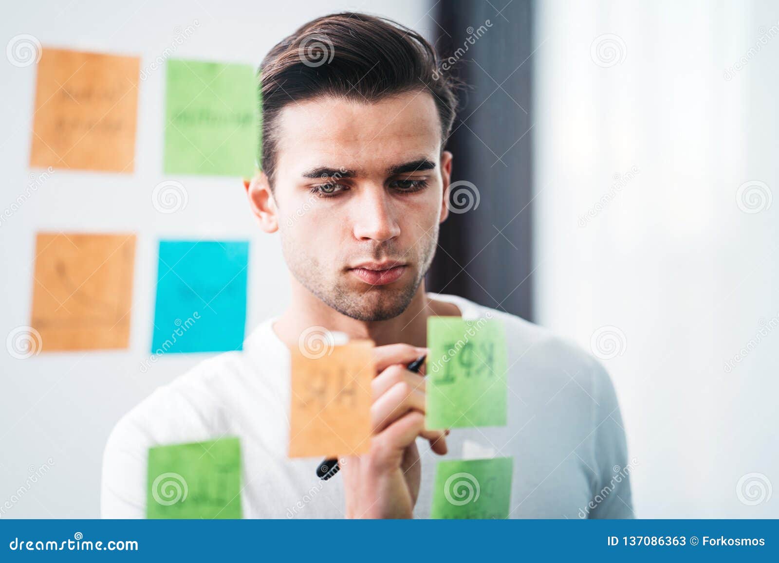Creative Man Writing Sticky Note on Glass Wall at Office Space Stock Image  - Image of creative, management: 137086363