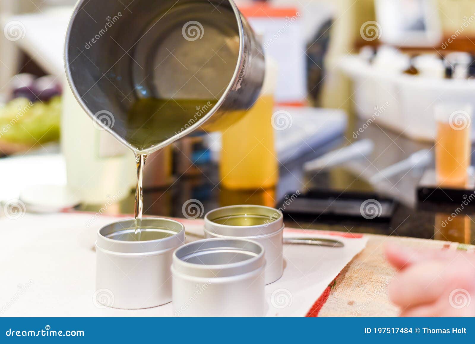 Creative Occupation of Candle Making Showing the Pouring of Liquid Wax