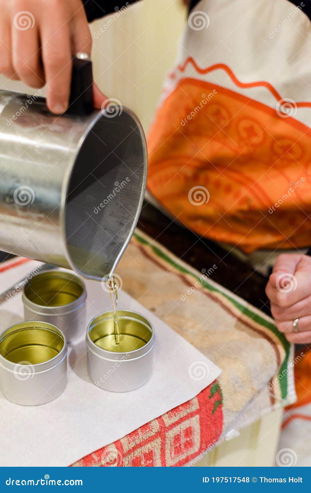 Creative Occupation of Candle Making Showing the Pouring of Liquid Wax