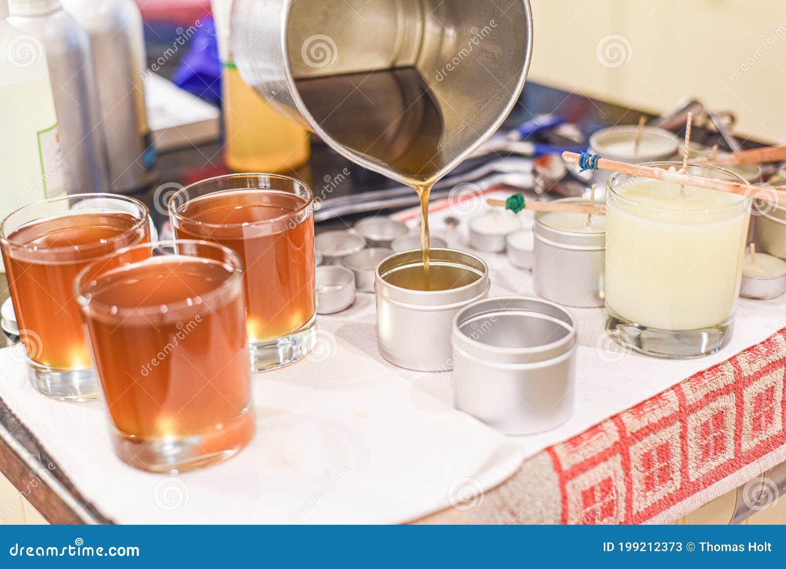 Creative Occupation of Candle Making Showing the Pouring of Liquid Wax