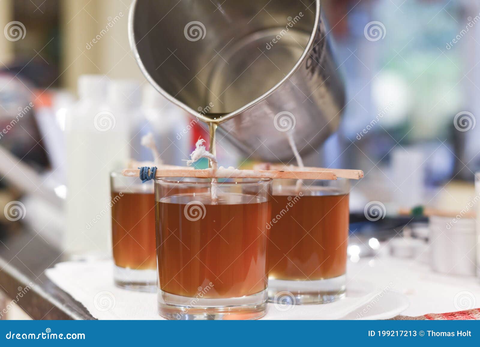 Creative Occupation of Candle Making Showing the Pouring of Liquid Wax