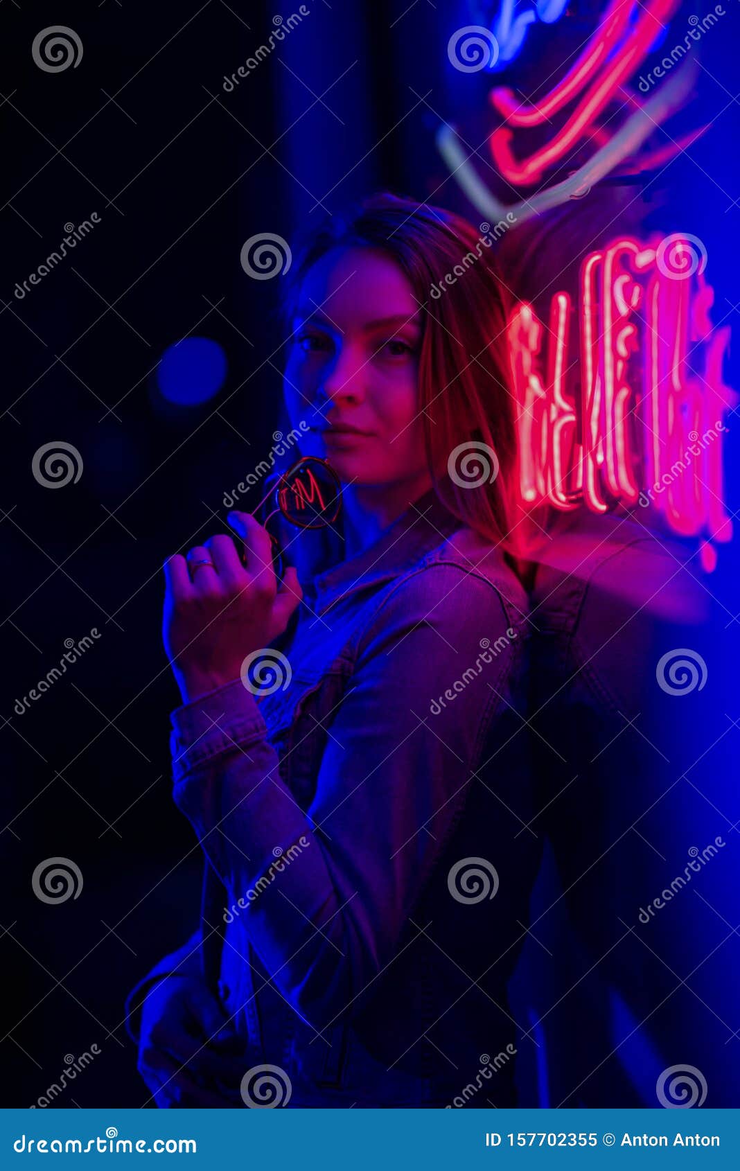 Creative Sexual Portrait of a Girl in Neon Lighting with Glasses, Night Party, Dancing, Game Business, Striptease Stock Image photo