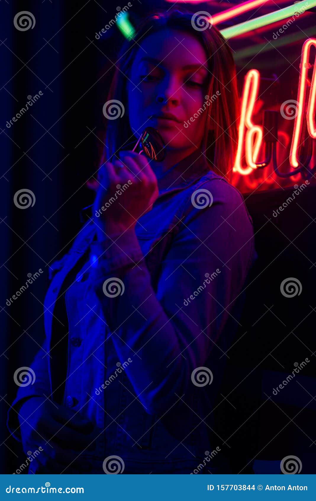 Creative Sexual Portrait of a Girl in Neon Lighting with Glasses, Night Party, Dancing, Game Business, Striptease Stock Photo pic