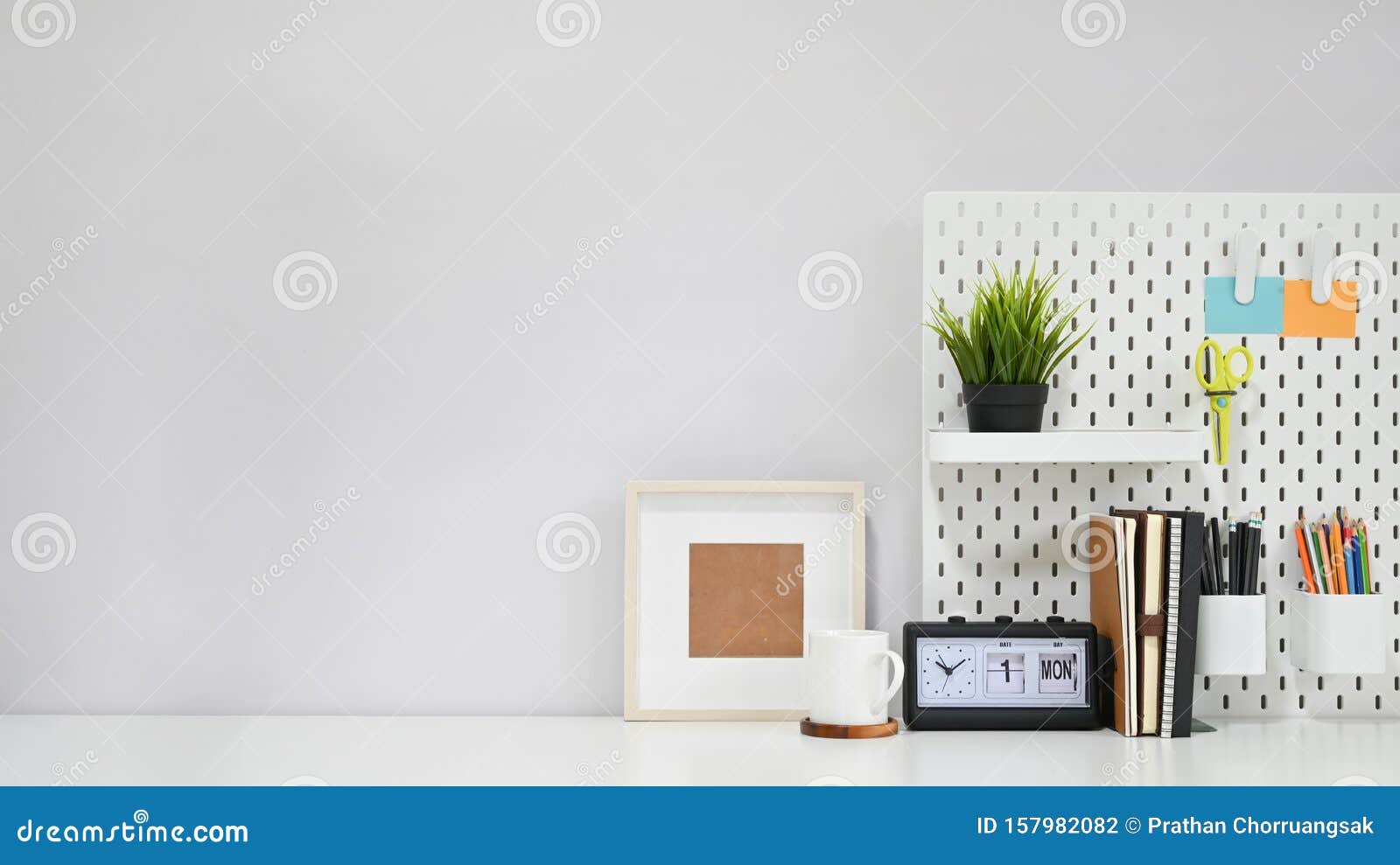 Creative Table Concept, Office Supply with Coffee Mug and Photo Frame
