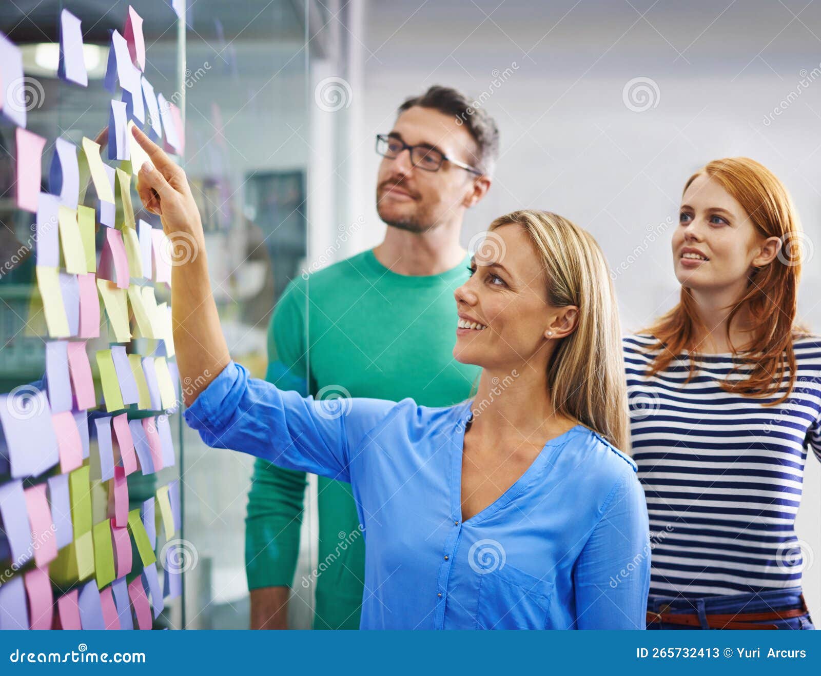 The Creative Wall. a Group of Business Colleagues Brainstorming at a