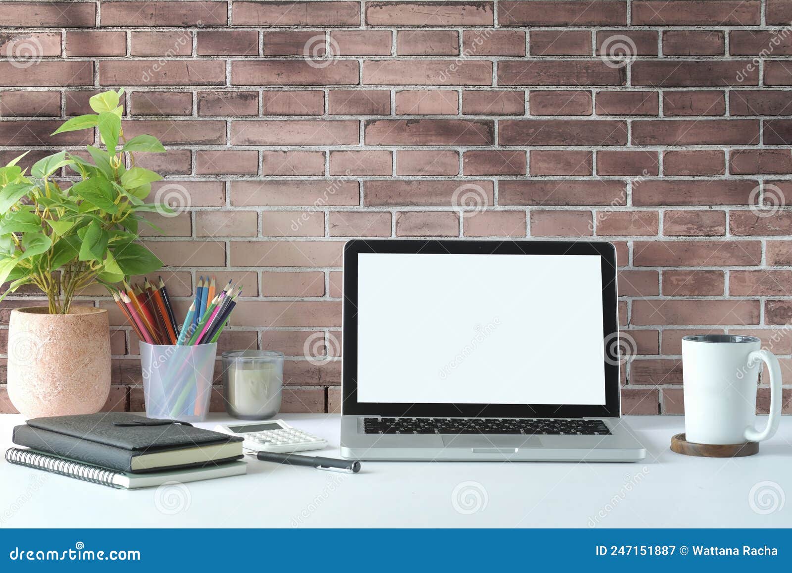 Creative Workplace with Laptop Computer, Coffee Cup, Pencil Holder and