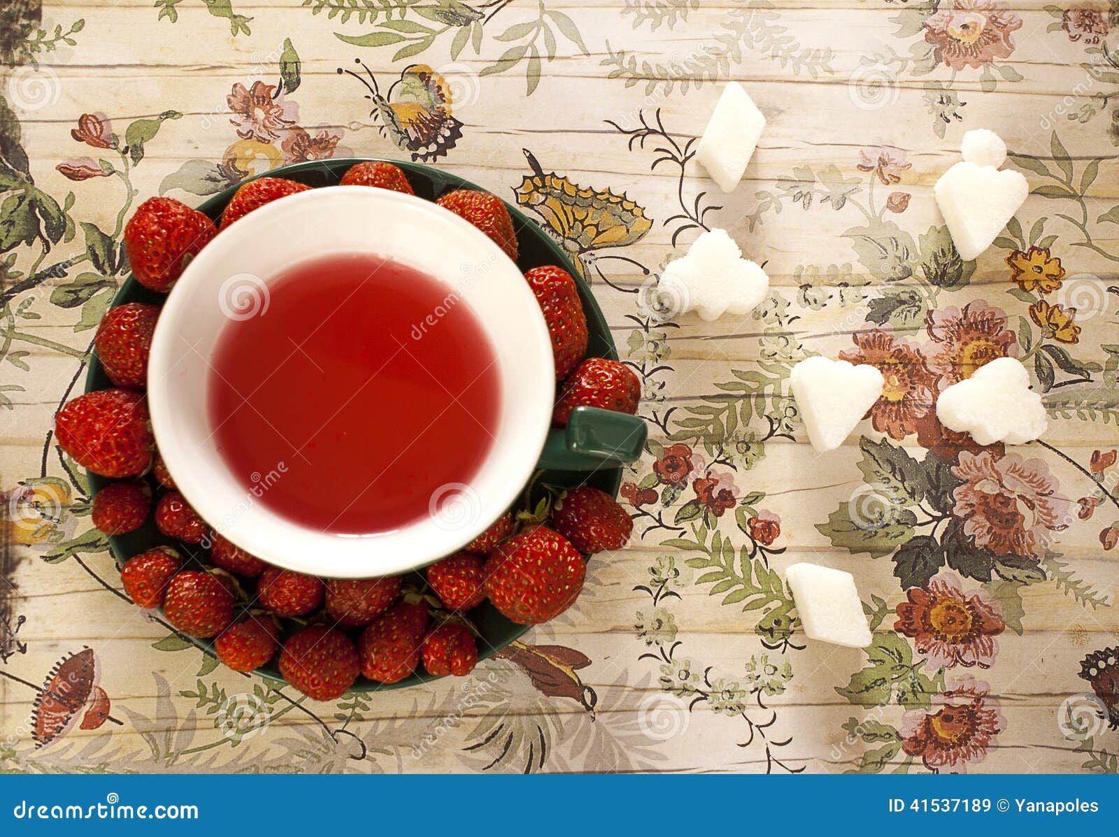 Creatively Served Fruit Tea And Strawberries On Saucer Stock Image