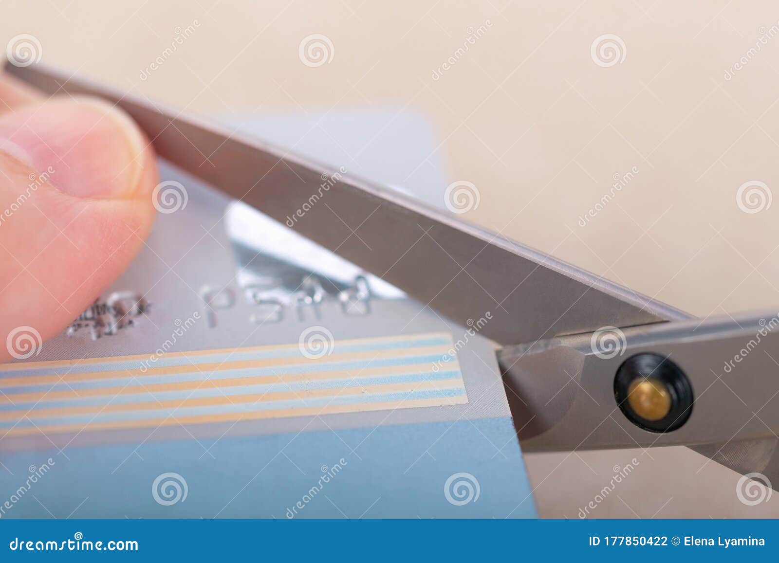 Credit Card Cutting Process with Scissors.Soft Focus Stock Photo