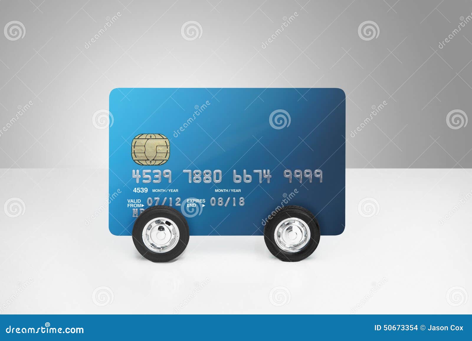 Credit card on wheels stock photo. Image of wealth, cards 50673354