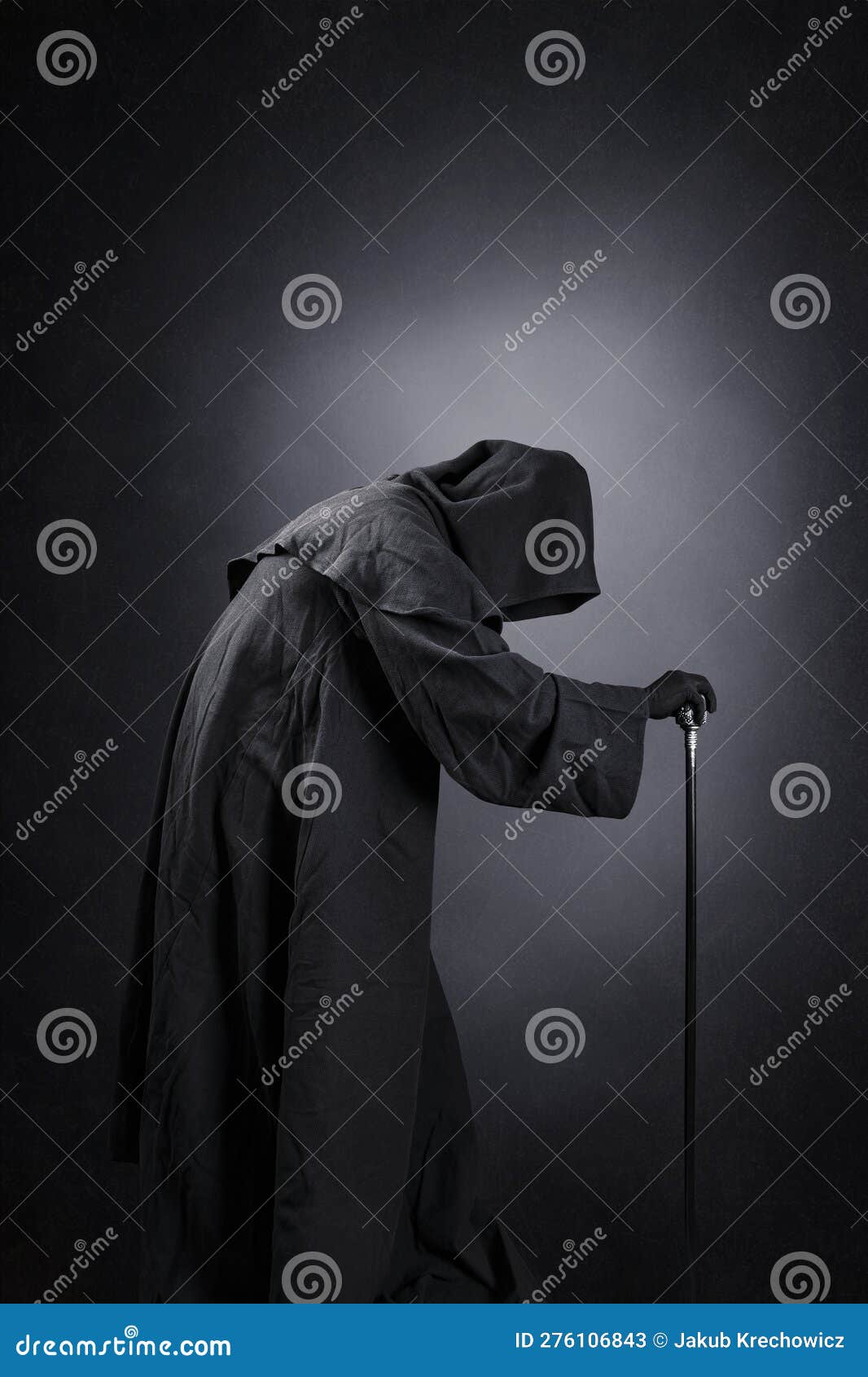 Creepy Figure in Hooded Cloak with Staff Over Dark Background Stock ...