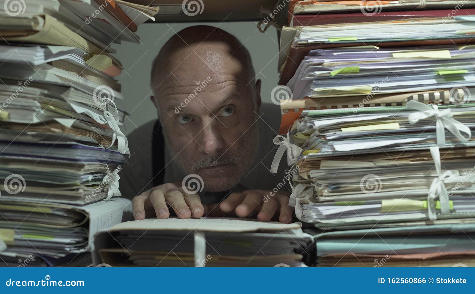 creepy office clerk overloaded with paperwork