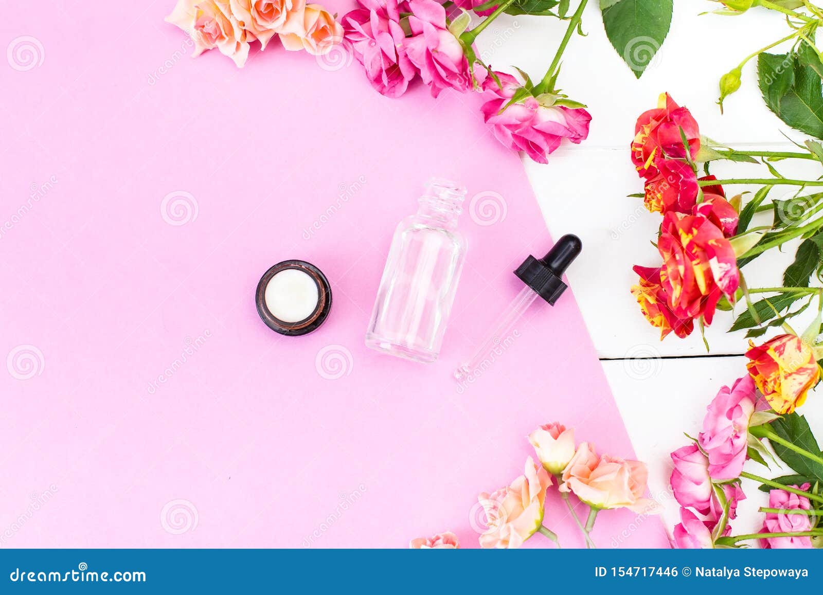 crema skincare cosmetics essence, oil on a pink and white desk. beauty background mock up