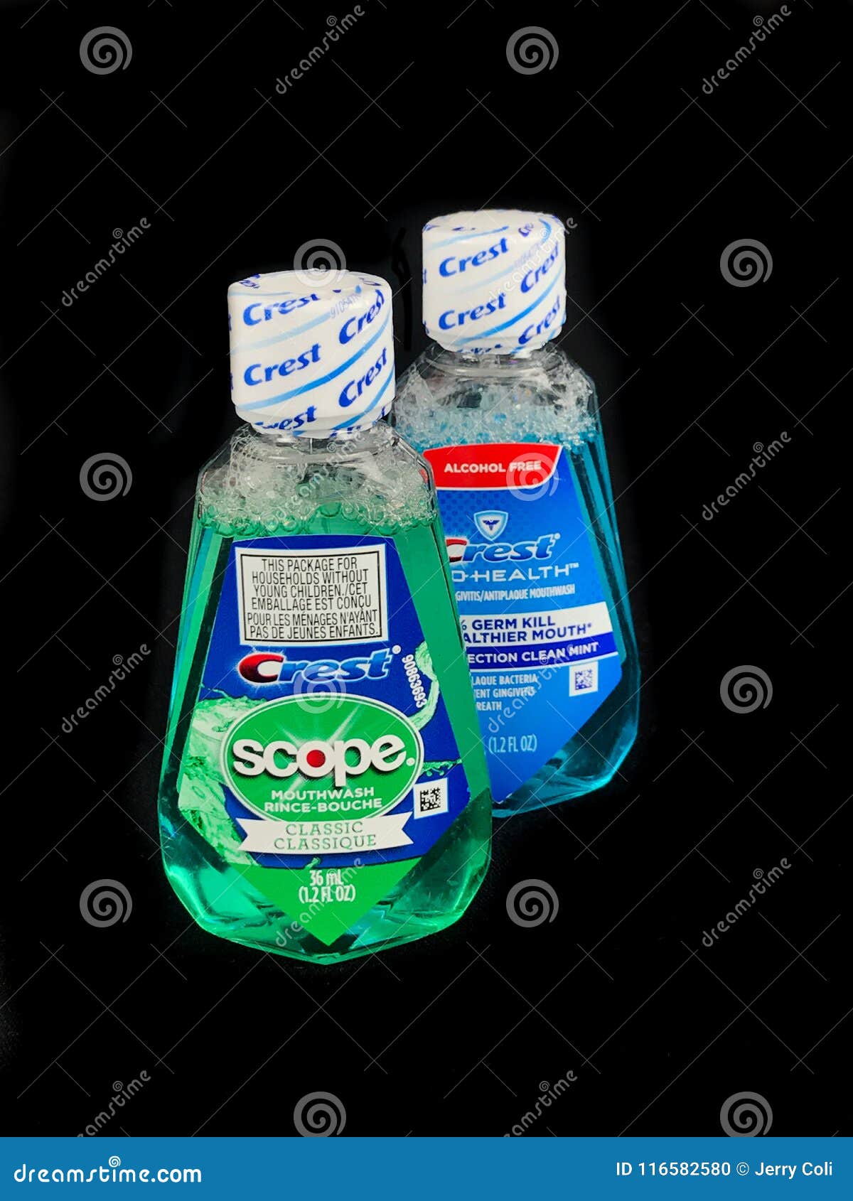 Travel Size Bottles of Crest Mouthwash on a Black Backdrop Editorial