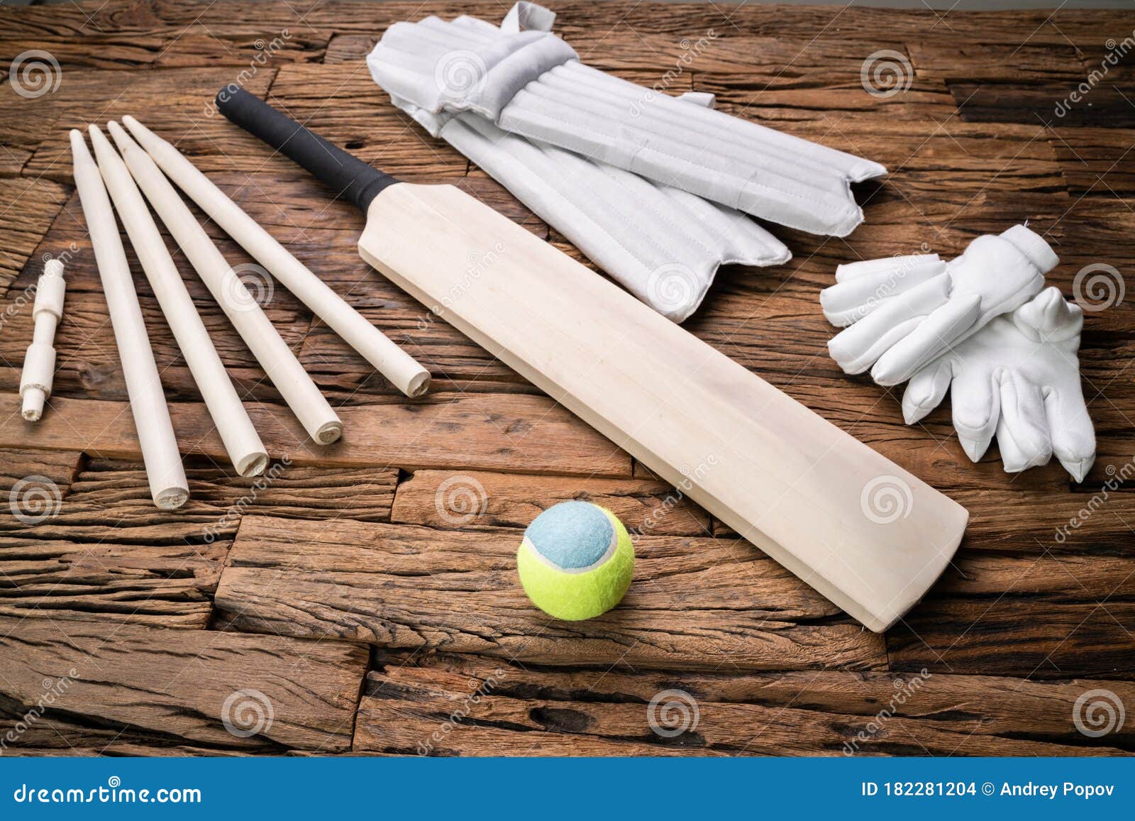 Cricket Accessories and Tools on Textured Backdrop Stock Photo