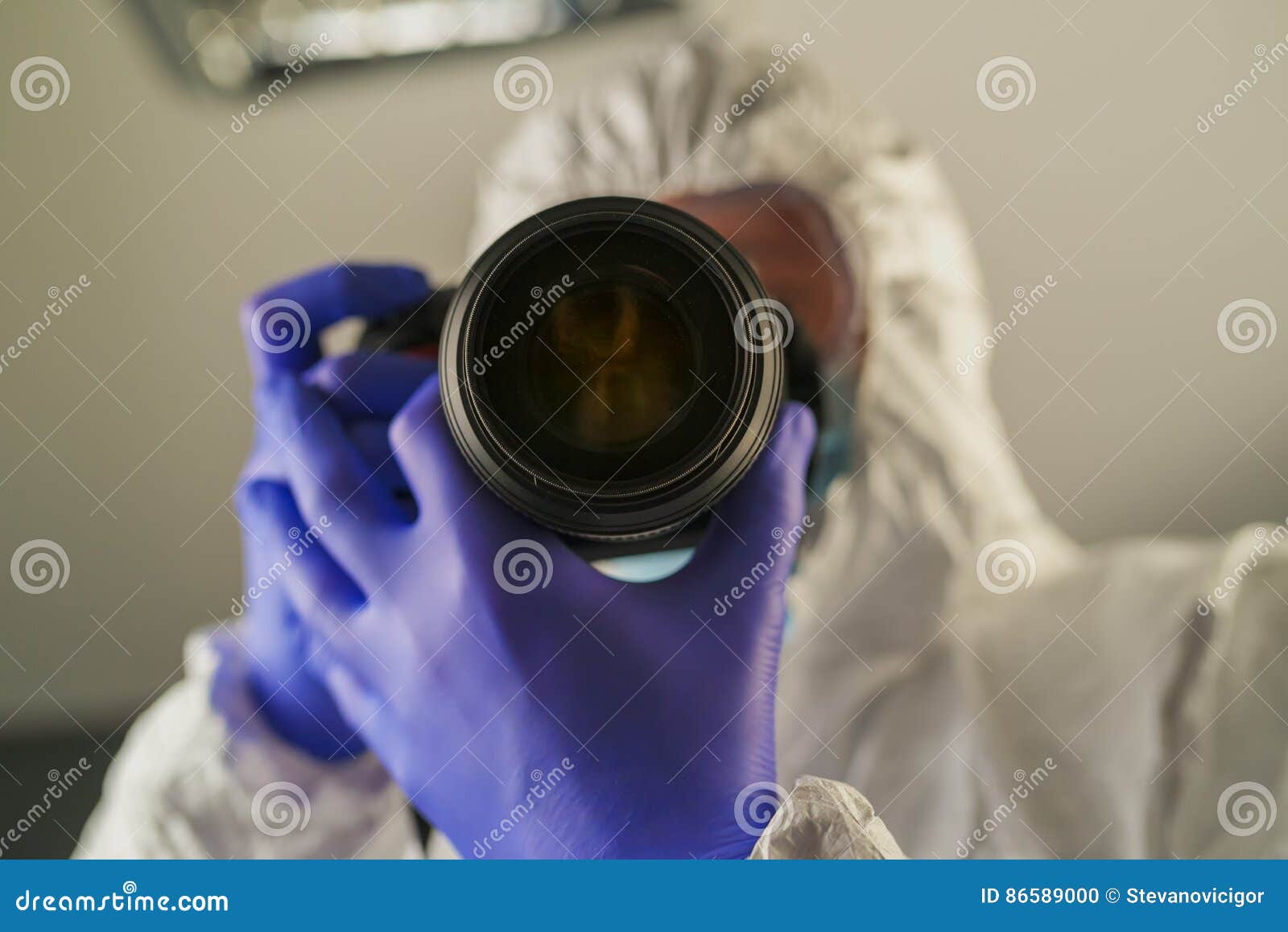 crime scene forensics investigator with digital camera