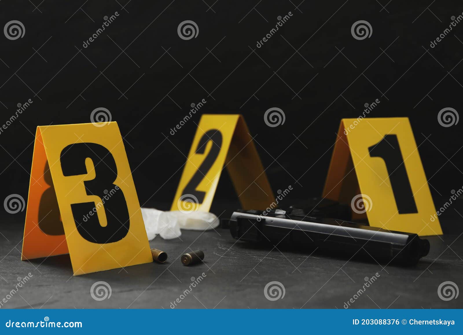 crime scene markers and evidences on black background