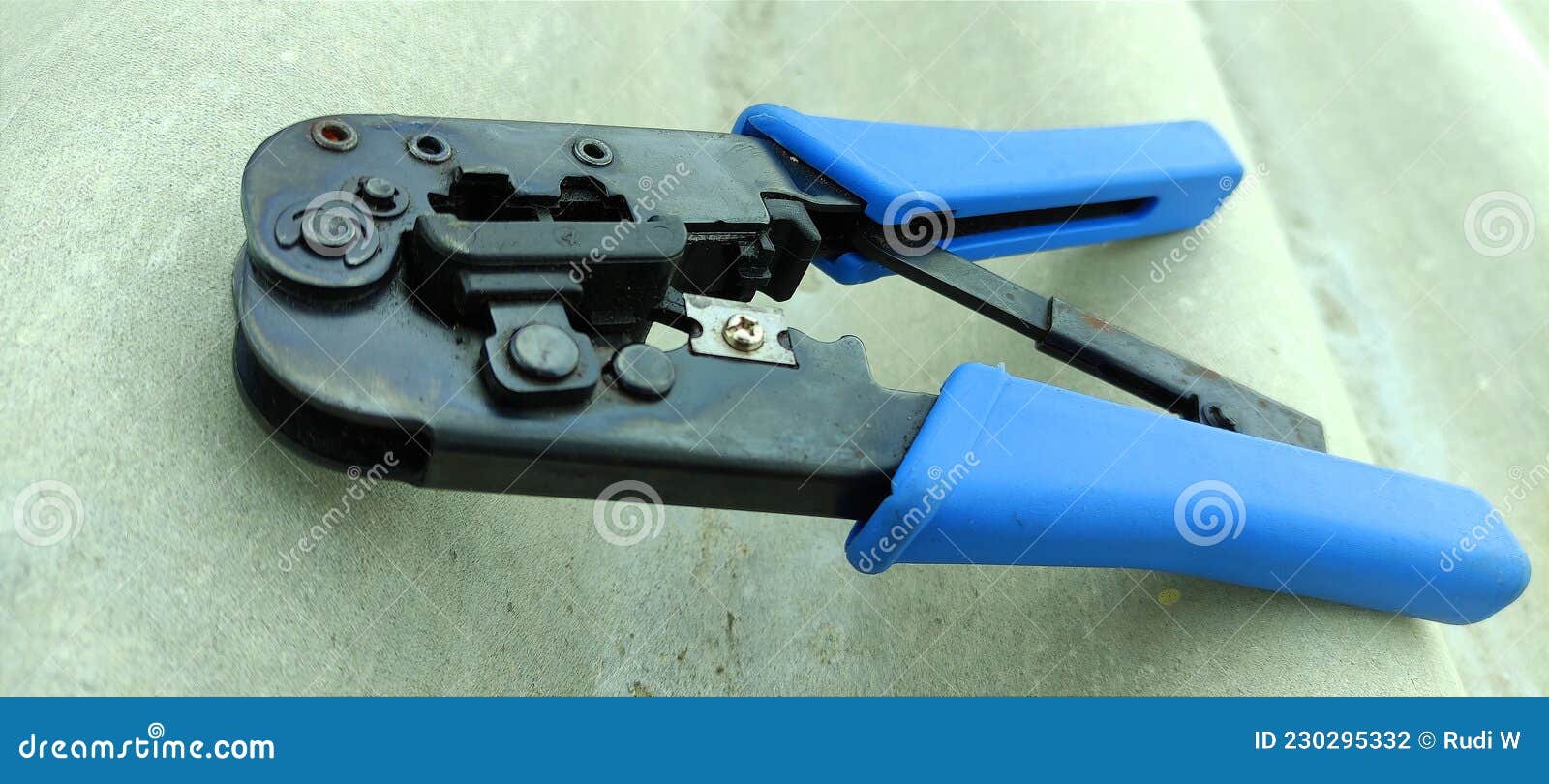 Crimping Tool for an Electrician on a Dark Background. Press the Pliers