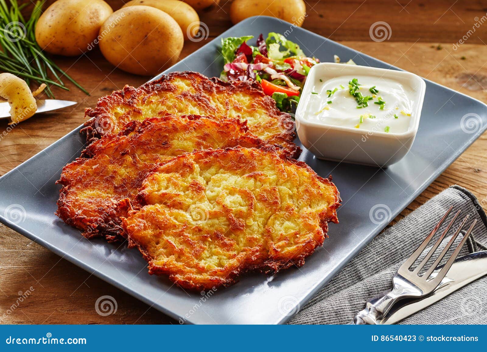 crisp fried potato rosti served with salad and dip