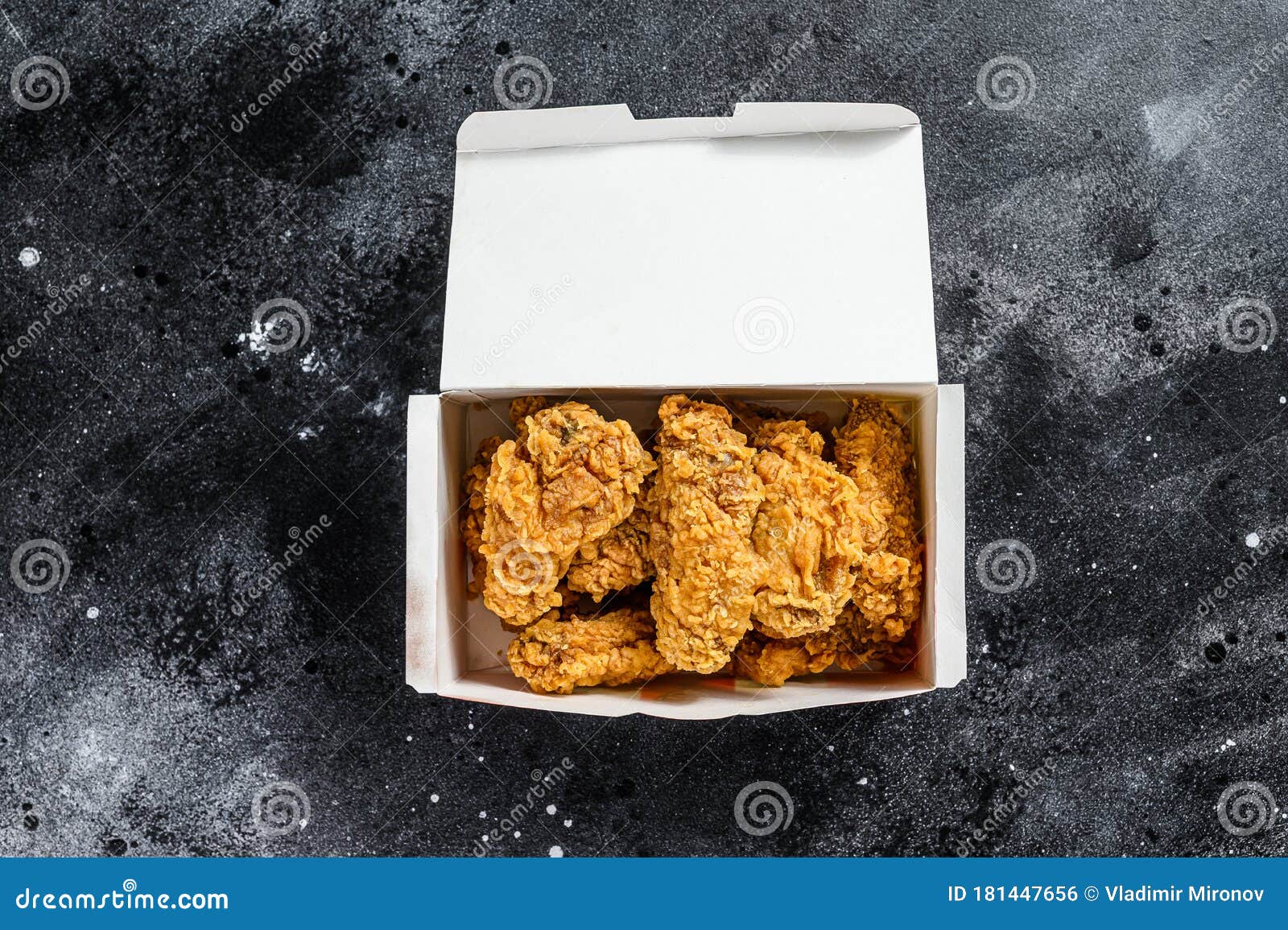 Crispy Barbecue Chicken Wings in a Takeaway Box. Black Background Stock