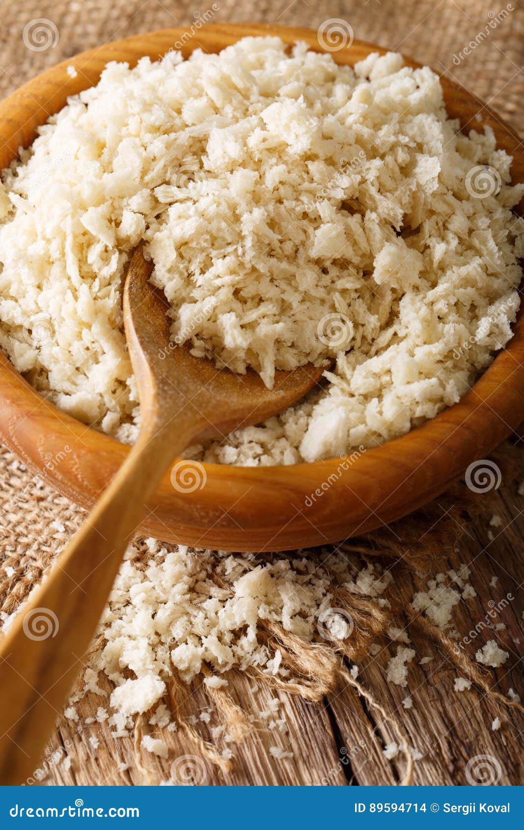 Crispy Breadcrumbs Panko for Breading in a Bowl Macro. Vertical Stock